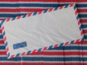 placing discount forever stamp on a letter