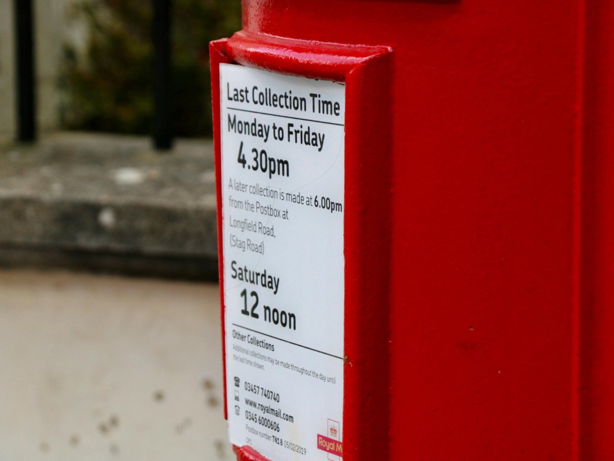 A detailed spreadsheet in an Oakland operations hub comparing USPS retail pricing with surplus bulk stamp discounts for 2026.