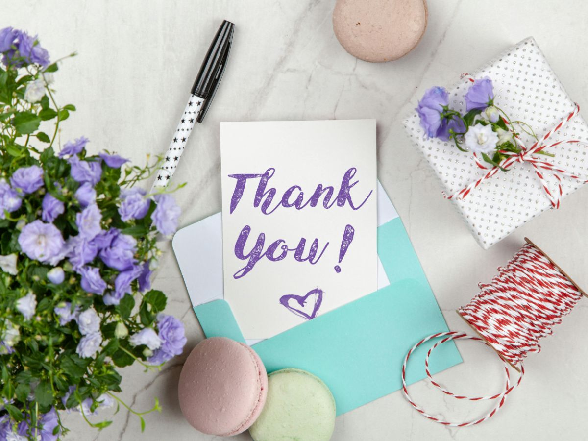 A logistics manager in Dallas reviewing a holiday stamp case study for his company's seasonal mailing, checking the authenticity of 1,000-unit coils of USPS holiday stamps.