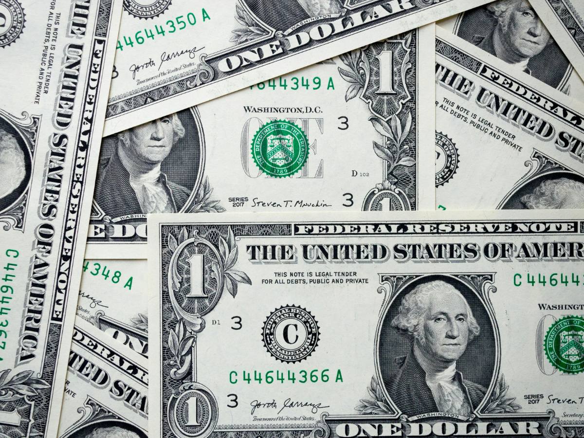 A local firm partner in Philadelphia reviewing a wedding stamp user story for an associate, checking the authenticity of 1,000-unit coils of USPS two ounce stamps.